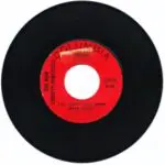 A red and black record with the words " the big red one ".