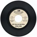 A black and white record with the words " donna lorin " on it.