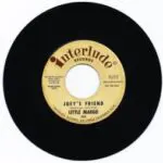 A yellow and black record with the words " joey 's friend " on it.