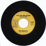 A yellow and black record with the words " love me for myself ".