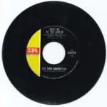 A black and yellow record with the words " i 'm gone ".