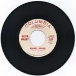 A black and white record with the words " columbia " on it.