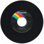 A black record with a rainbow on the side.