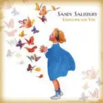 A child standing in front of butterflies with the words sandy salisbury.