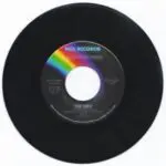 A black record with rainbow label on it.